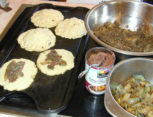Pupusas stuffed with sauted mushrooms and pesto
