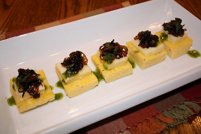 Polenta Cakes with Caramelized Onions, Brie and Basil Oil