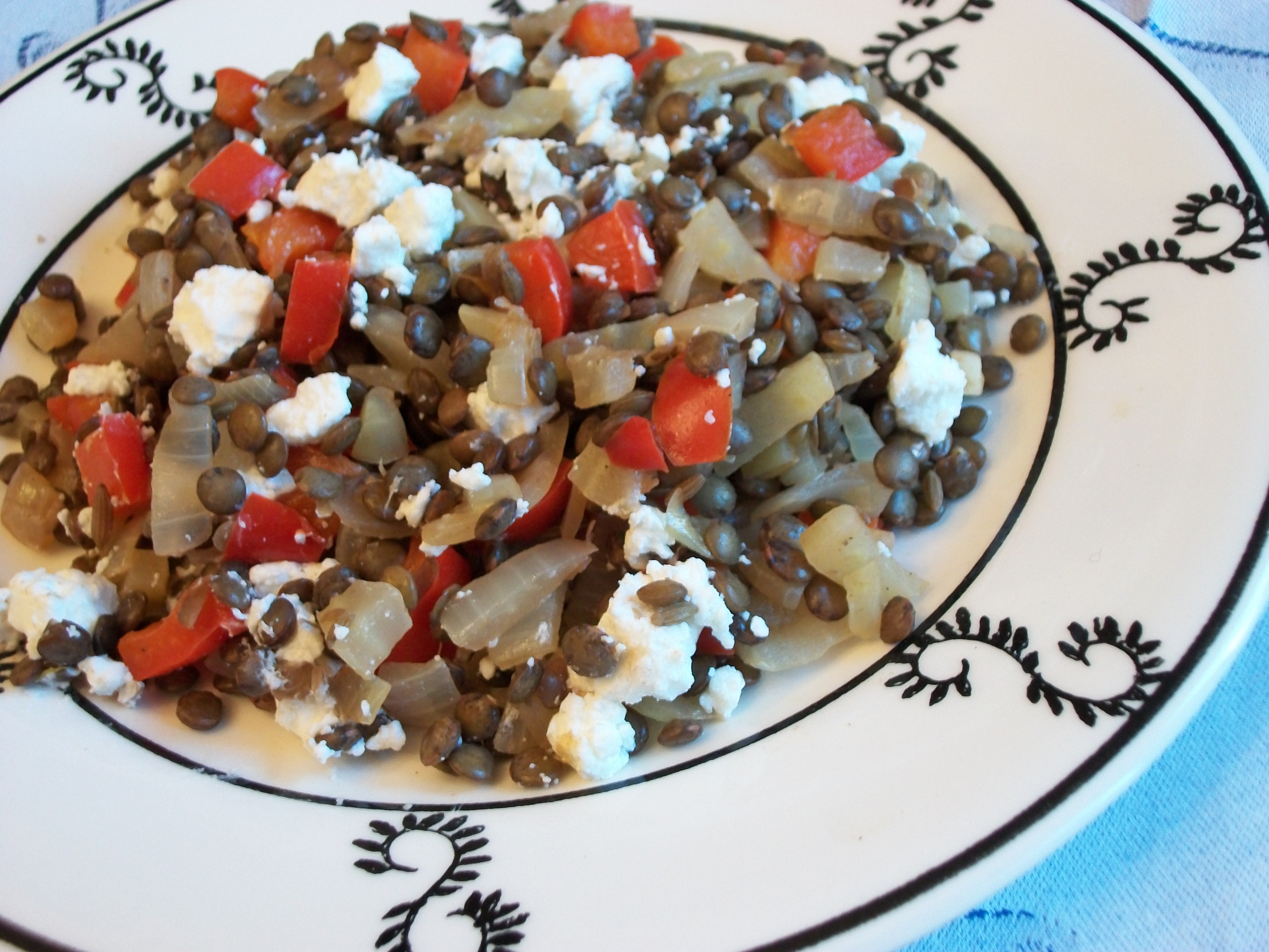 Warm lentil and goat cheese salad
