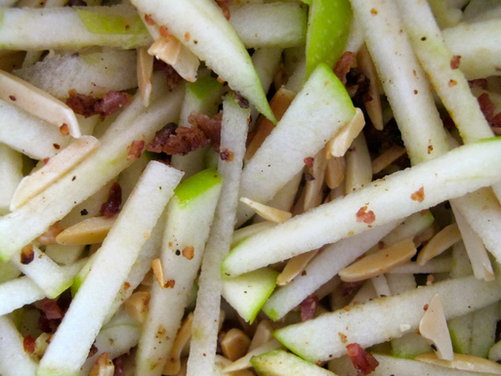 APPLES WITH ALMONDS, BACON AND PECORINO ON A BED OF ARUGULA