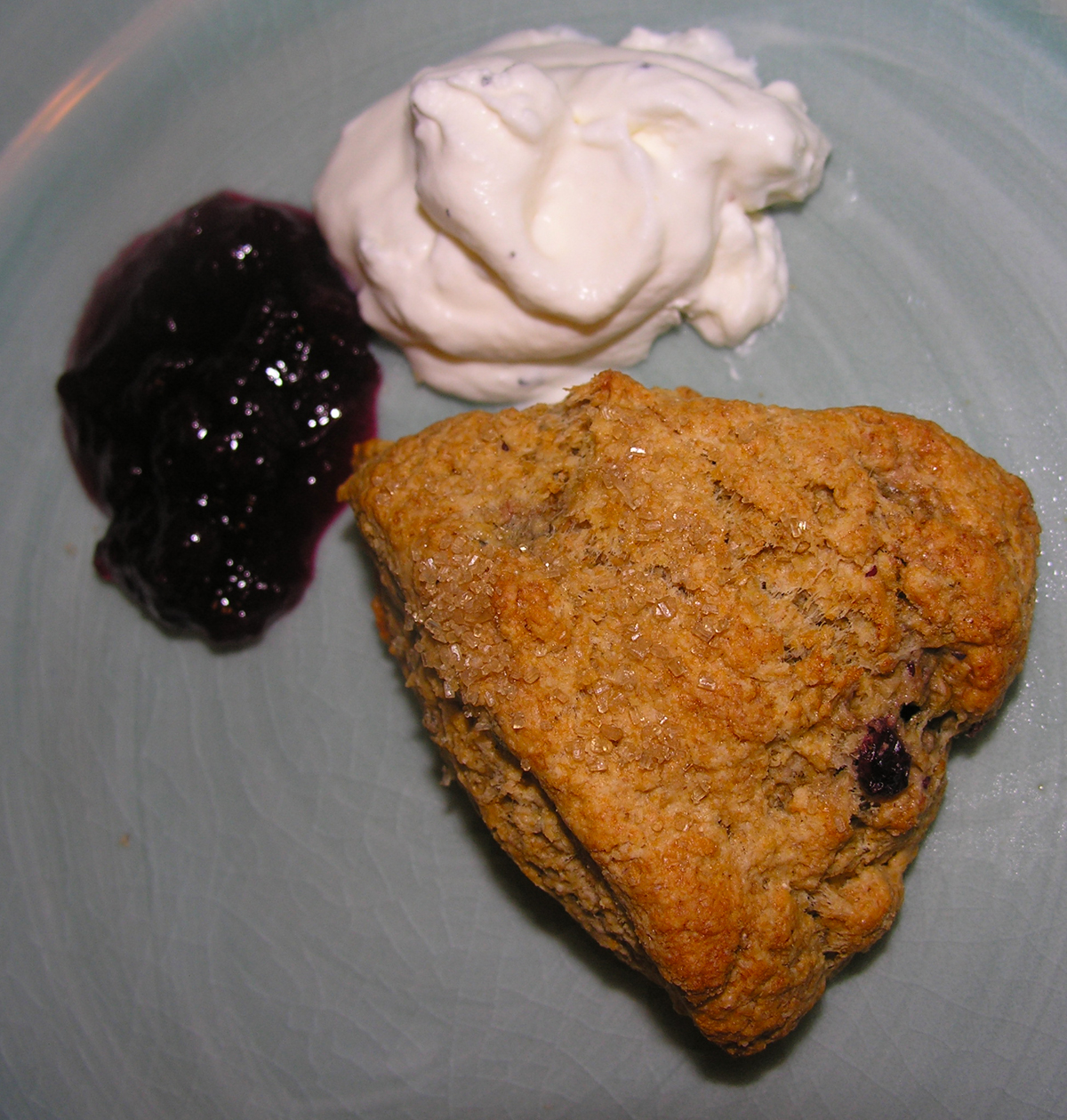 Whole grain scones with green cardamom and lingonberry