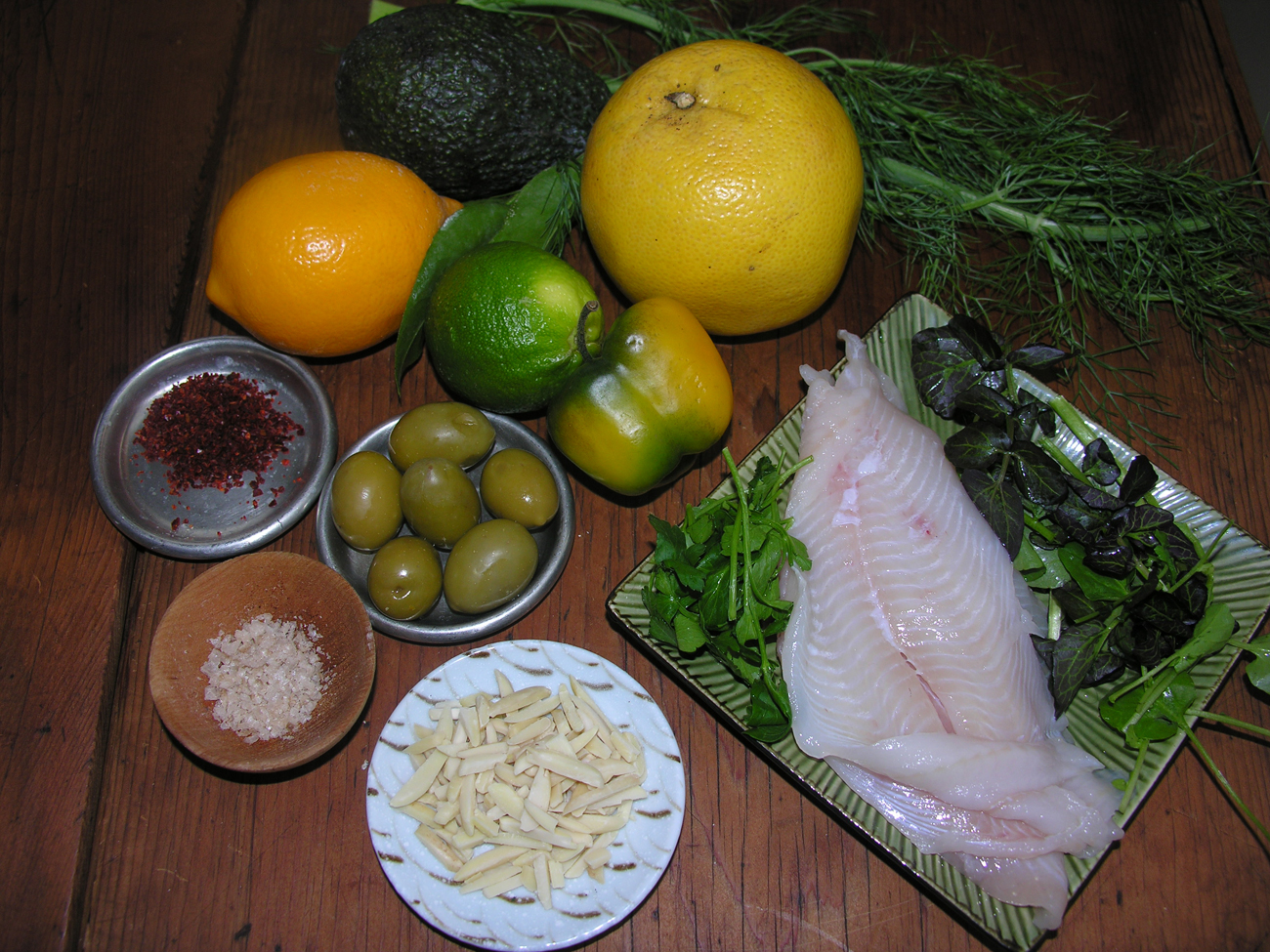 Ceviche with pink grapefruit and green olives