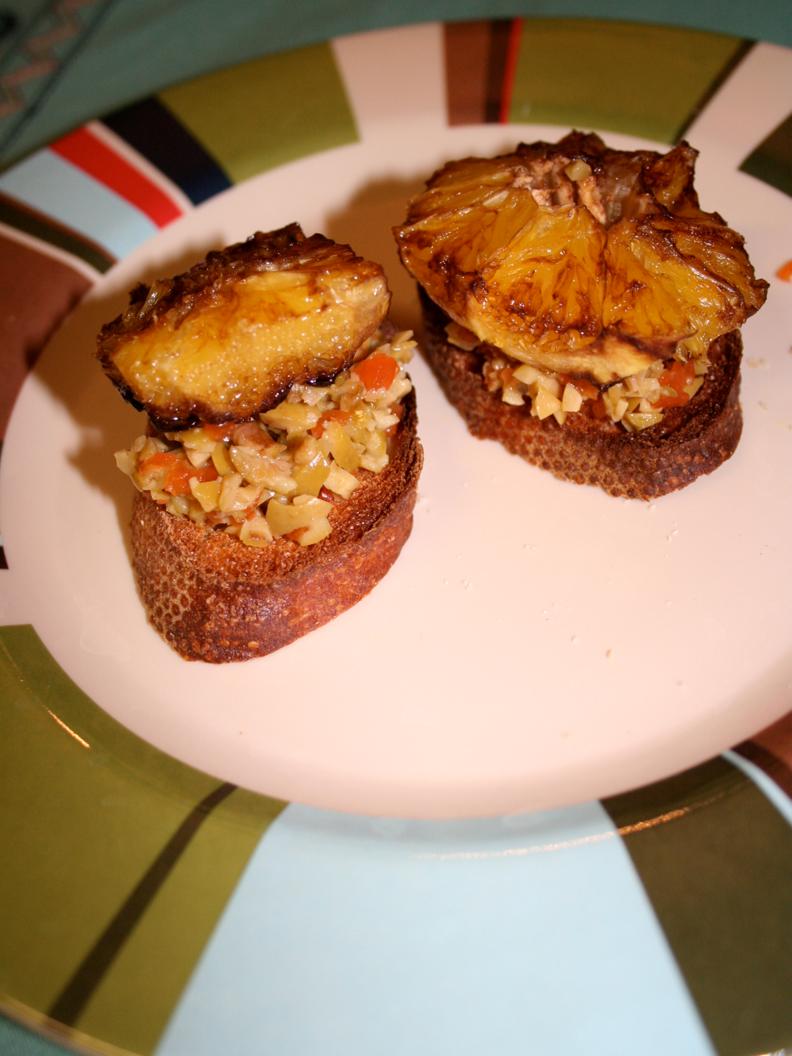 Crostini Topped with Balsamic-Simmered Oranges and Crushed Olives