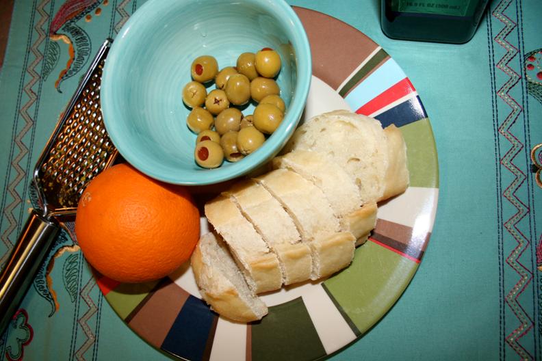 Crostini Topped with Balsamic-Simmered Oranges and Crushed Olives