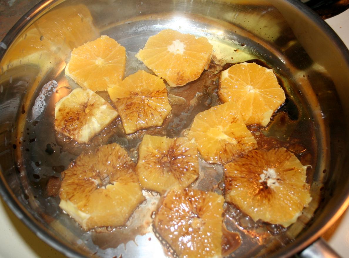 Crostini Topped with Balsamic-Simmered Oranges and Crushed Olives