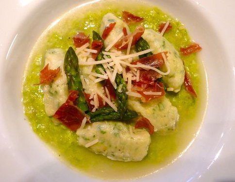 Homemade Goat Milk Ricotta Gnudi on Asparagus Puree in a Parmesan Brodo