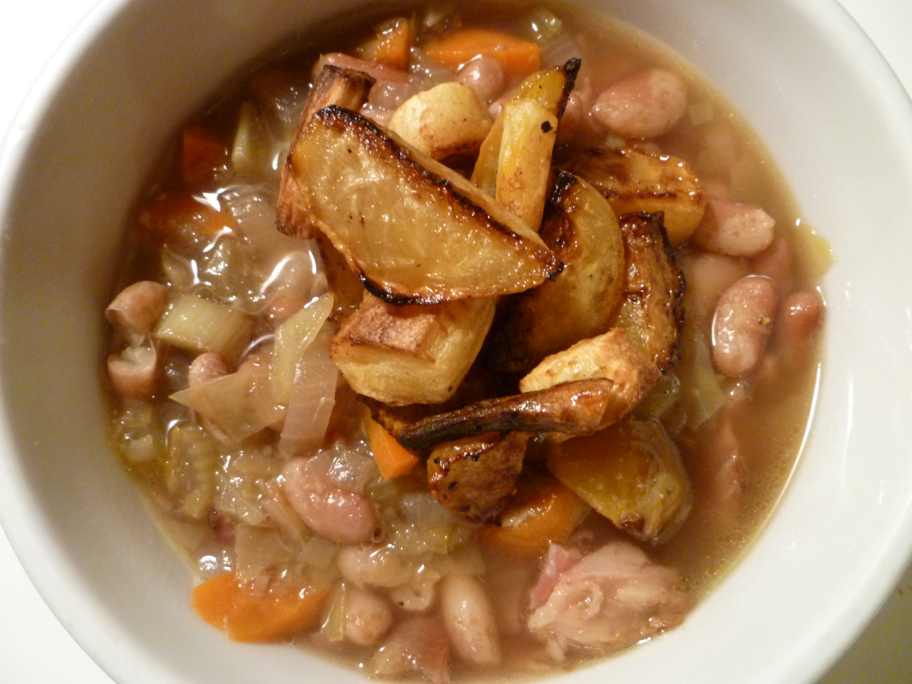Bean and ham stew with roasted vegetable garnish