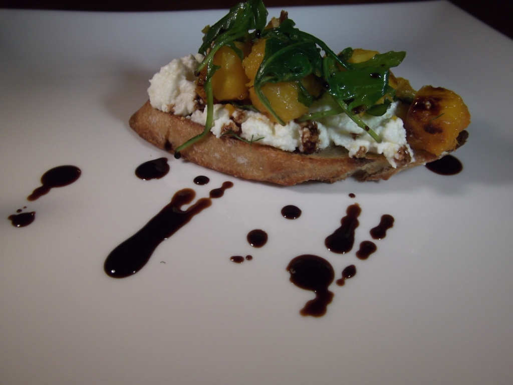 Ricotta crostini with butternut squash, arugula, and balsamic drizzle.