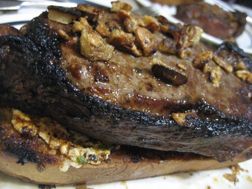 Broiled Spicy Steak with Garlic Chips on Gorgonzola Crostini