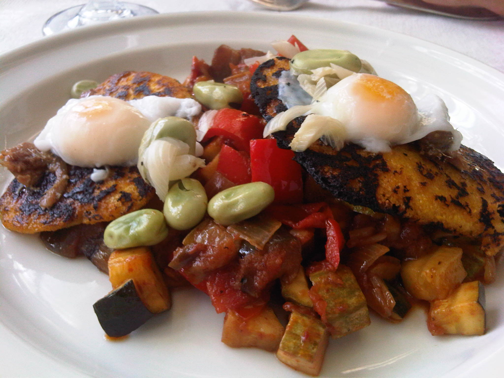 Ratatouille with corn galettes, anchovy and poached quail eggs