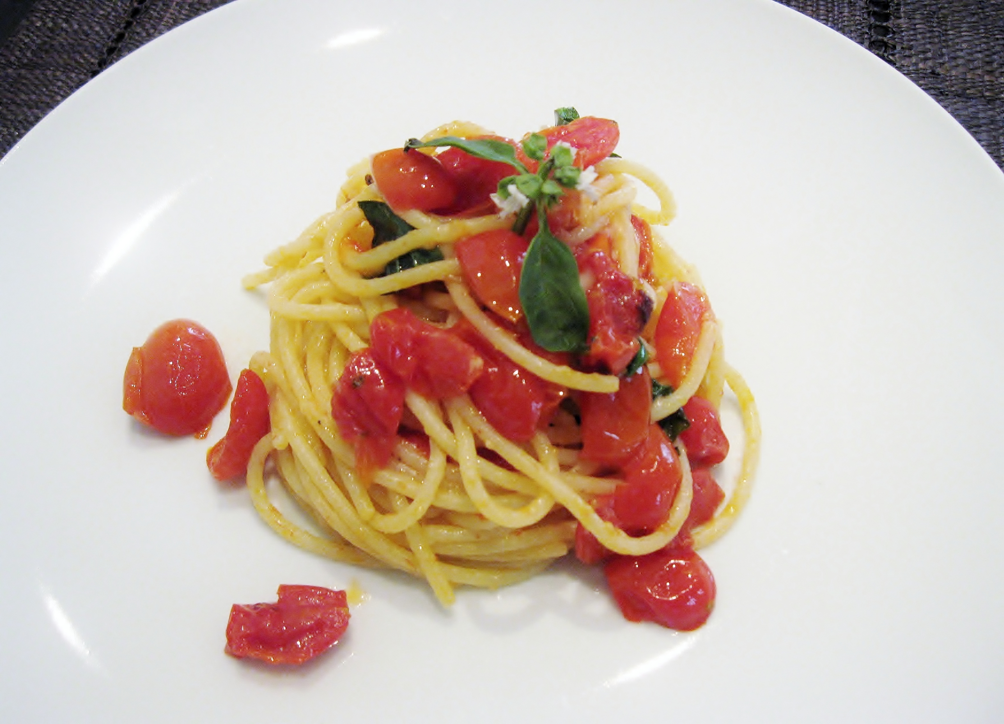 Spaghetti with tomatoes, basil and pecorino romano