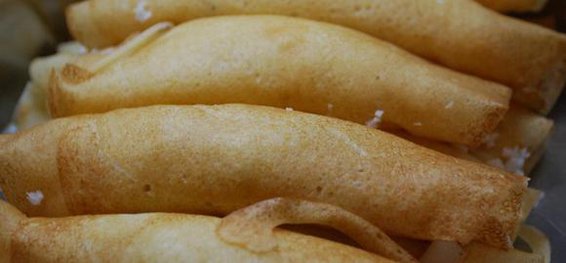 Pancakes Filled with Freshly Grated Coconut and Sugar