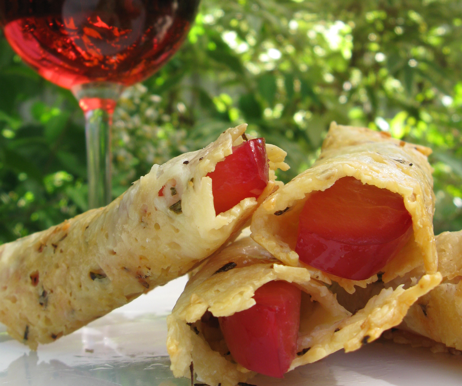 Parmesan Rosemary Tuille with Rosé-Poached Plums