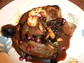 Pork Chop with Figs, Dates, Apples and Garlic in an Apple Cider Reduction Sauce