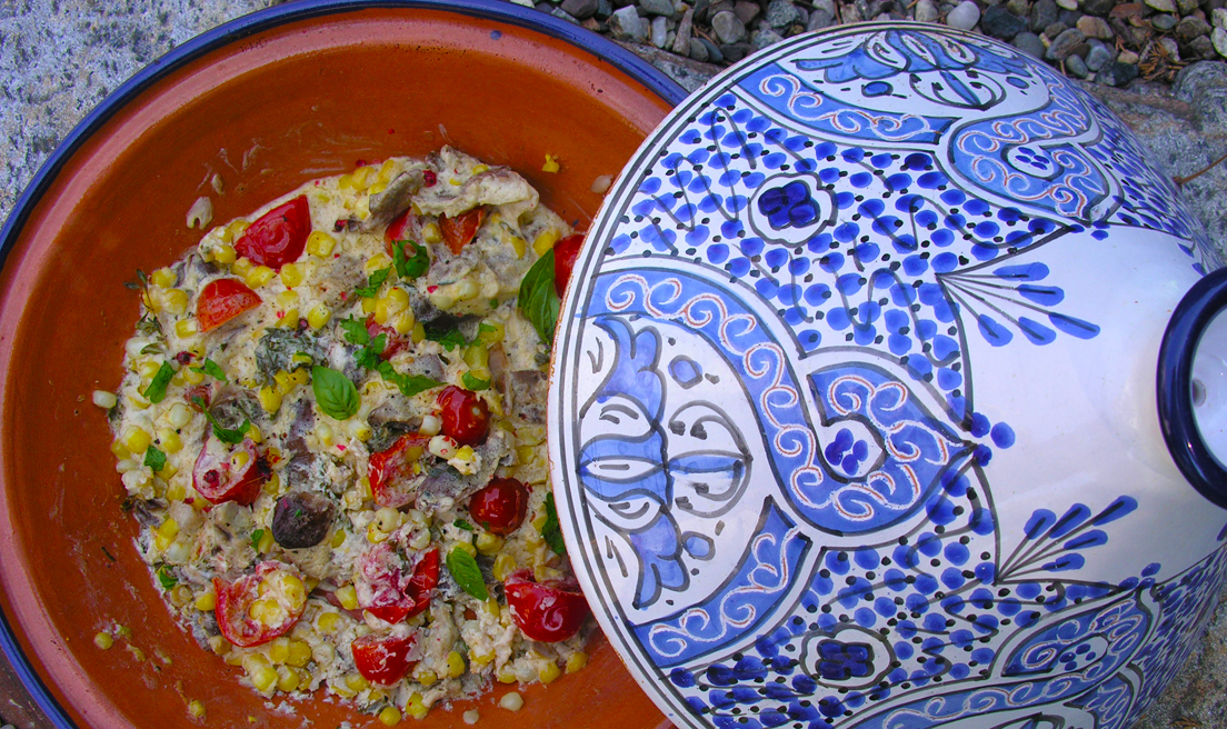 Creamy corn, mushroom and cherry tomatoes cooked in a tagine