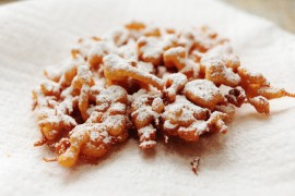 Orange Funnel Cake with Powdered Cinnamon Sugar and Maple Syrup