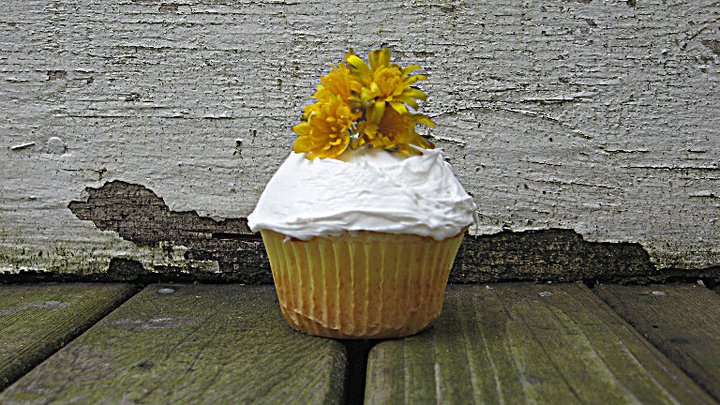 Lemon Poppy Seed Cupcakes Topped With Lemon Buttercream Frosting