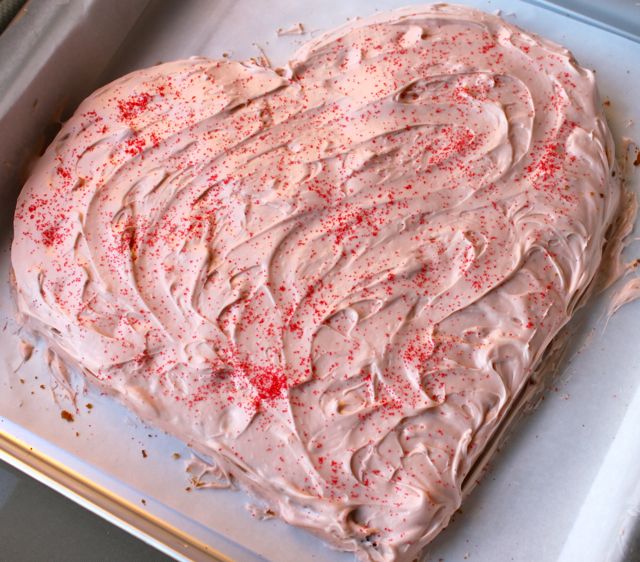Champagne raspberry heart shaped cake with cream cheese brown sugar frosting
