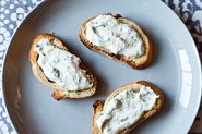 Herbed ricotta and anchovy crostini