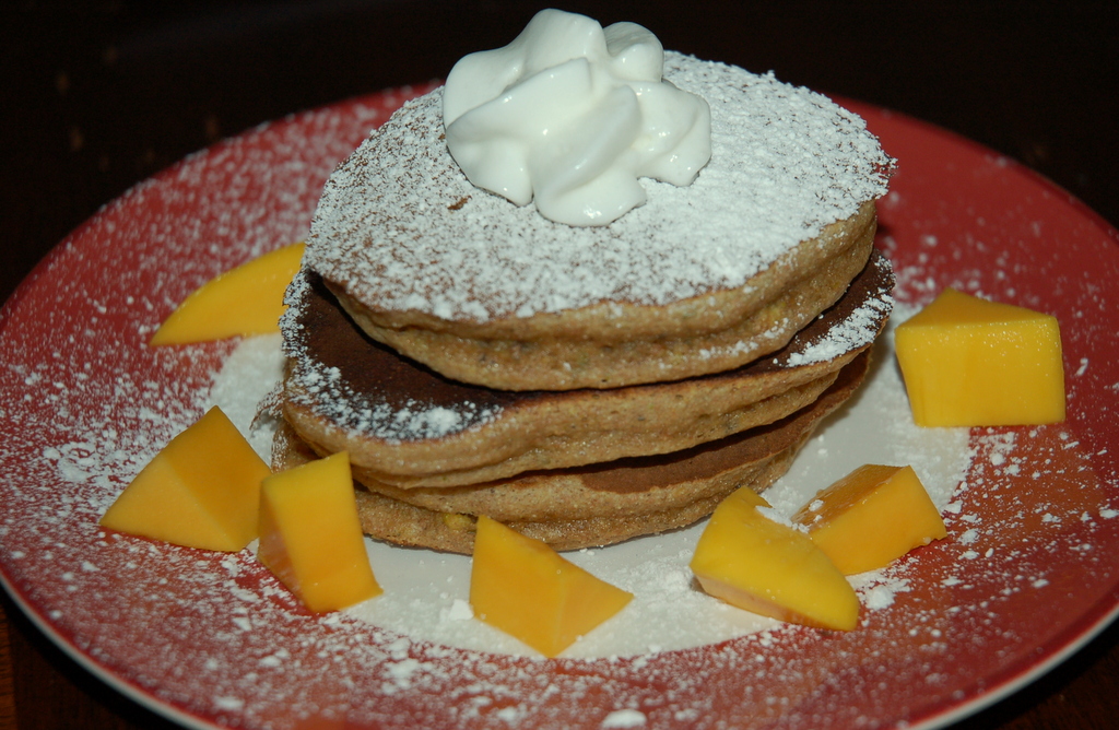 Spelt-Pistachio-Cardamom Pancakes with Mango and Cream