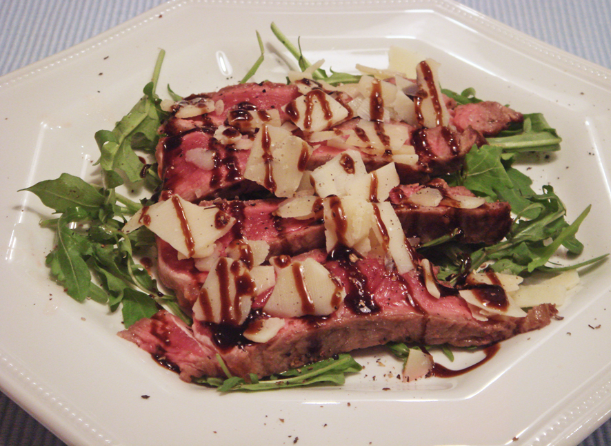 Grilled Steak on a Rocket Bead with Parmesan Shavings and Balsamic Glaze