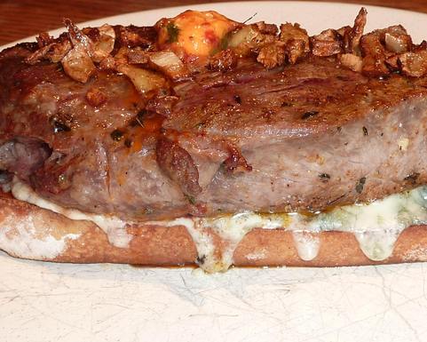 Broiled Spicy Steak with Garlic Chips on Gorgonzola Crostini