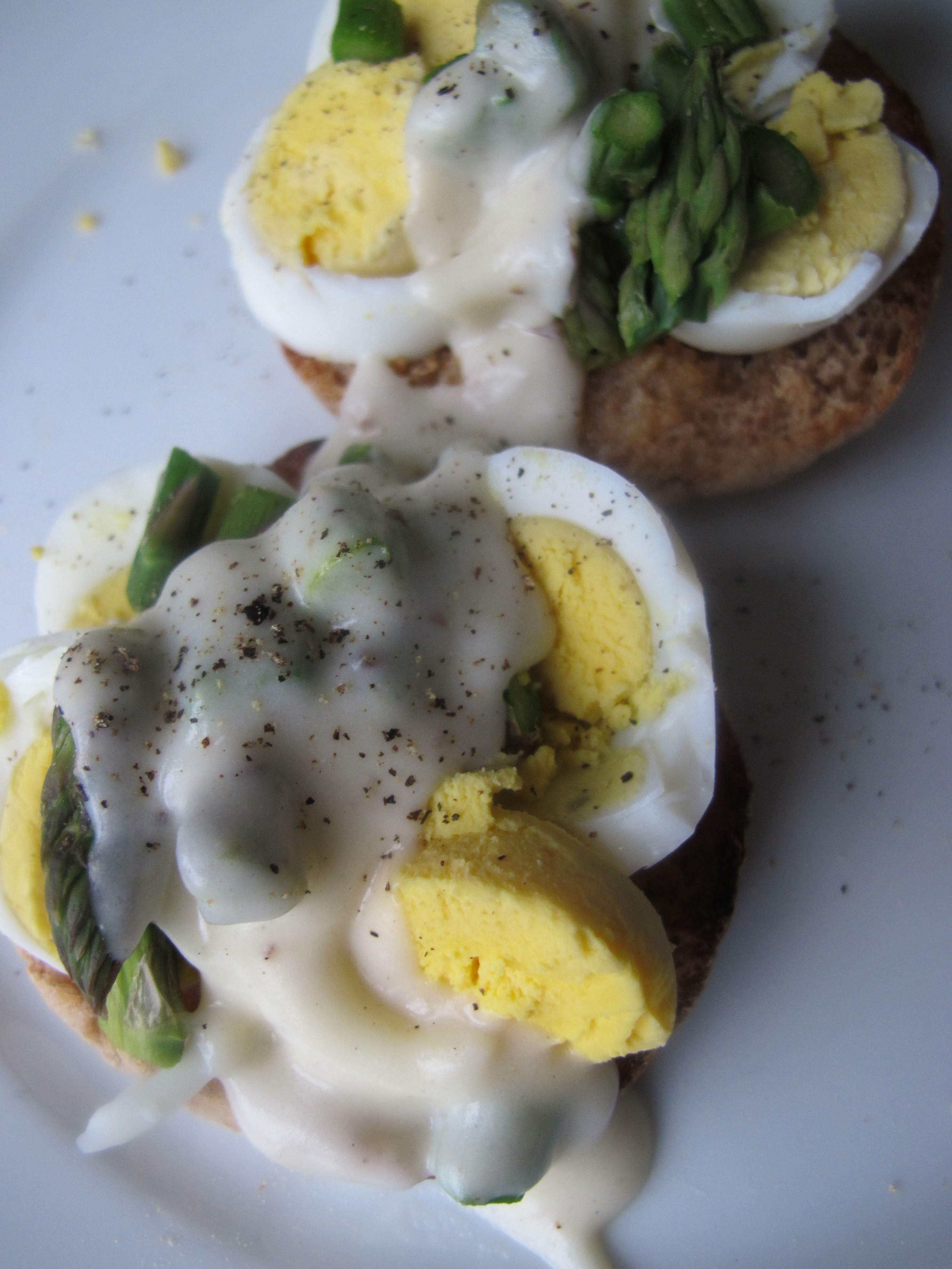 Chopped Eggs on English Muffins with Asparagus and Cheese Sauce