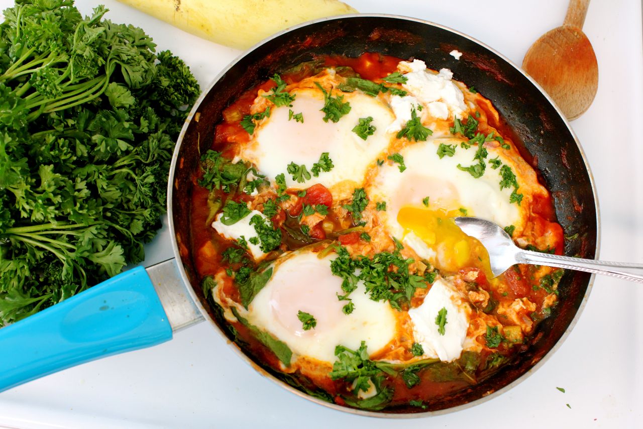 Shakshuka with Summer Squash, Spinach, and Goat Cheese