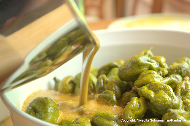 Pickled Baby mangoes in a chile mustard sauce (vadu Mangai)