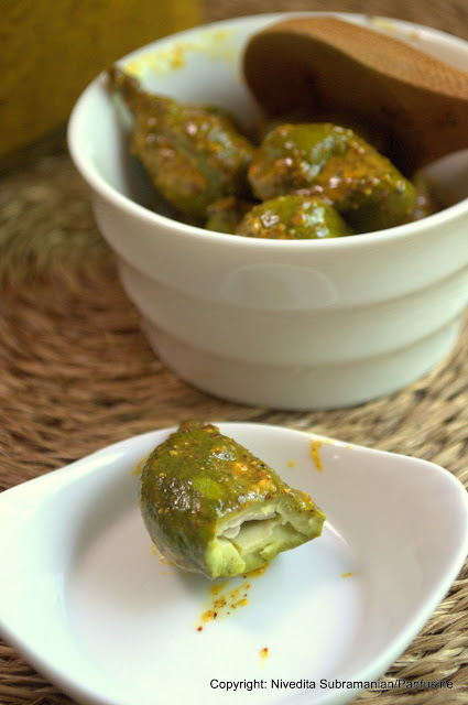 Pickled Baby mangoes in a chile mustard sauce (vadu Mangai)
