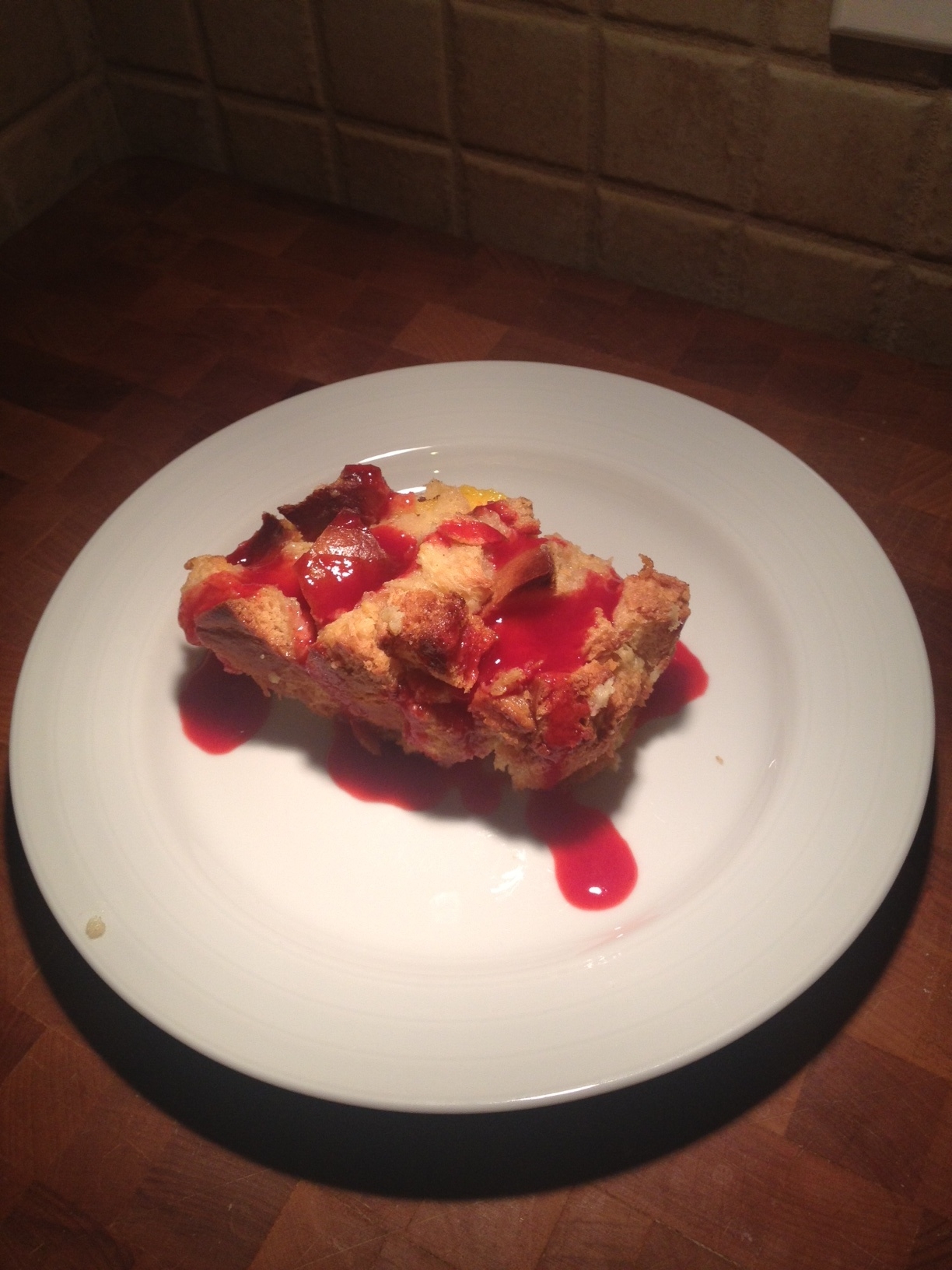 Gooey Mango Bread Pudding with Raspberry Sauce