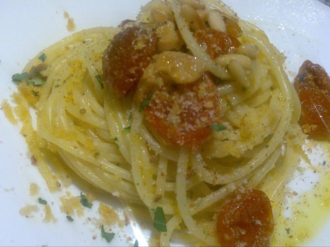 Botargo, aromatized brad, pinoles and dried tomatoes spaghetti