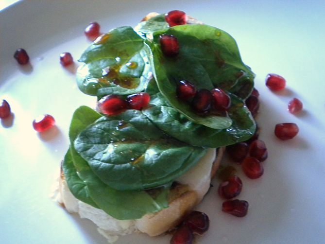 An Open Faced Sandwich of Kasseri, Spinach and Pomegranate