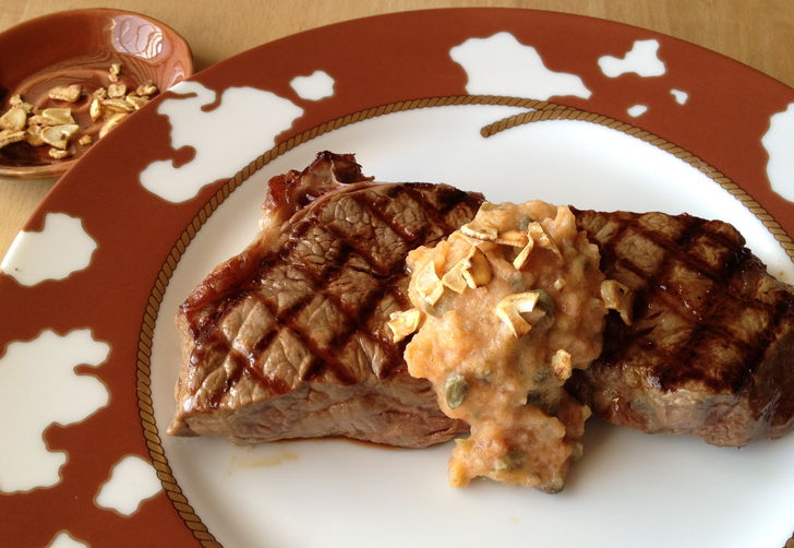 Persimmon Caper Seasoned Butter Dressing a Steak