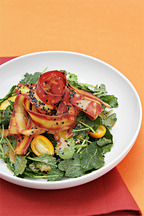 Baby kale salad with purple carrot ribbons, kumquats and sesame vinaigrette