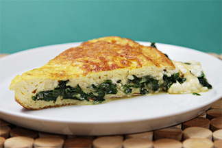 Soufflé omelet with Robiola and sautéed ramps