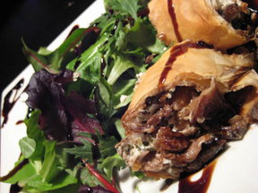 Wild Piedmont Mushroom & Goat Cheese Strudel served over Spring Arugula with toasted Pine Nuts
