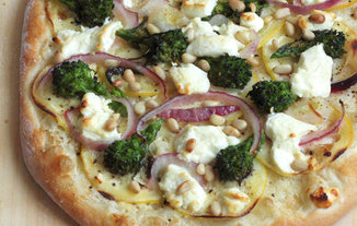 chèvre and rapini pizza with red onion, lemon, and pine nuts