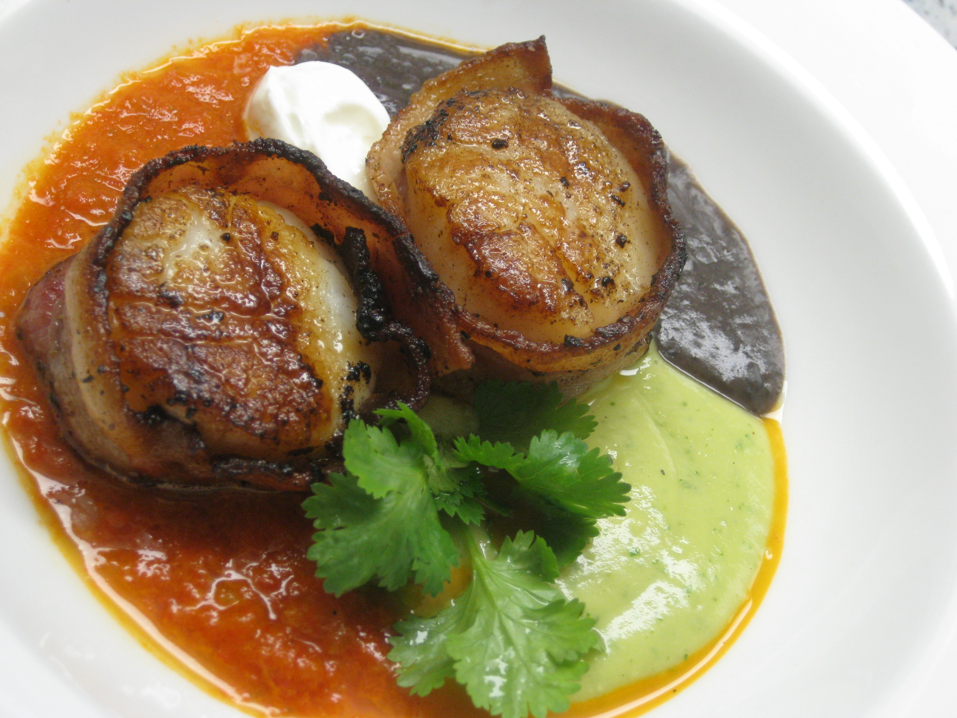 Bacon wrapped scallops with trifecta of Tex-Mex purees