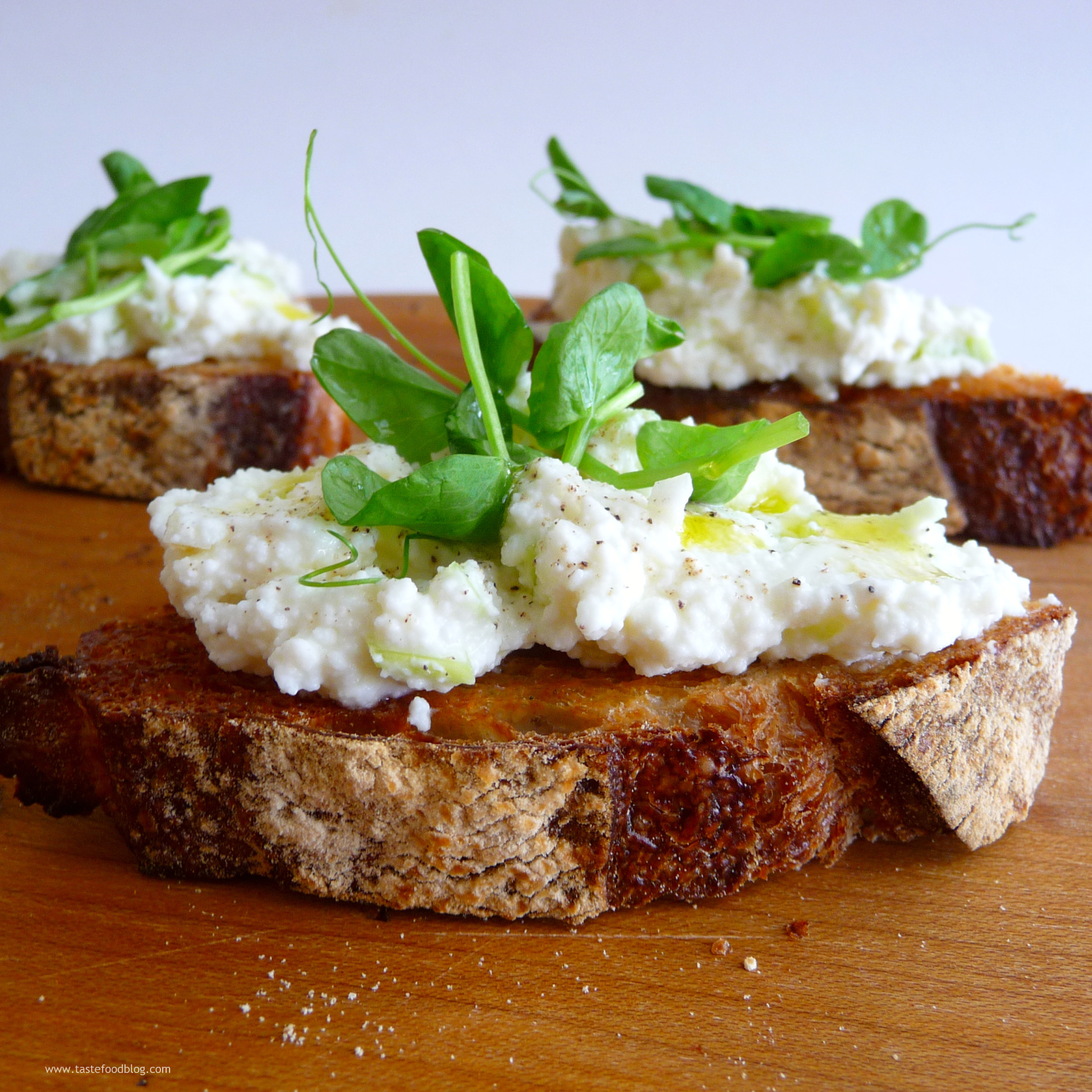 Ramped Up Crostini with Ricotta and Pea Shoots