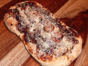 Pizza_with_bbq_pork_caramelized_onion_roasted_tomatoes