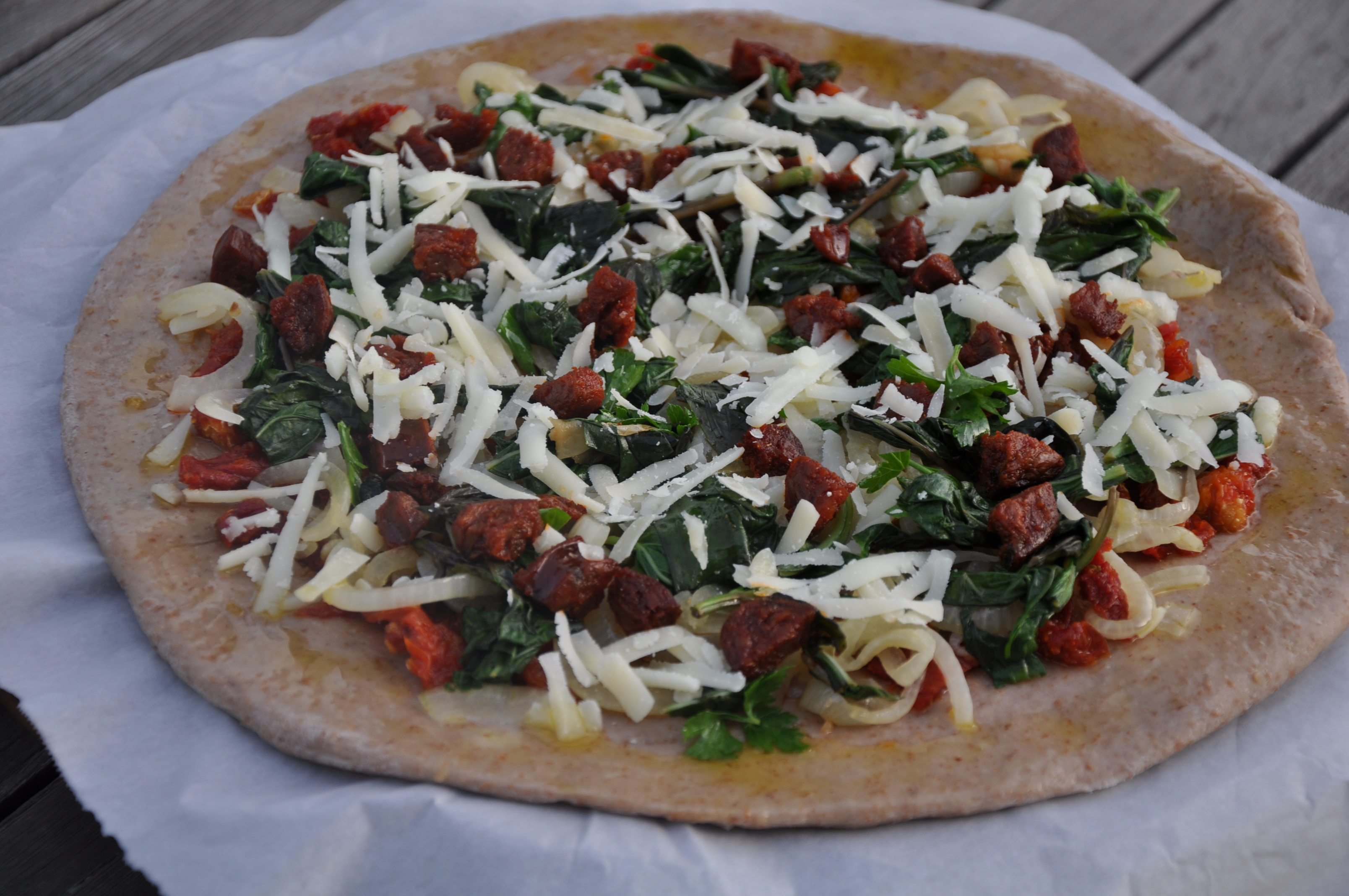 BigBear’s Welcome Home Pizza (Sun-Dried Tomato, Basil, Chorizo and Manchego on a Red Wine Crust)