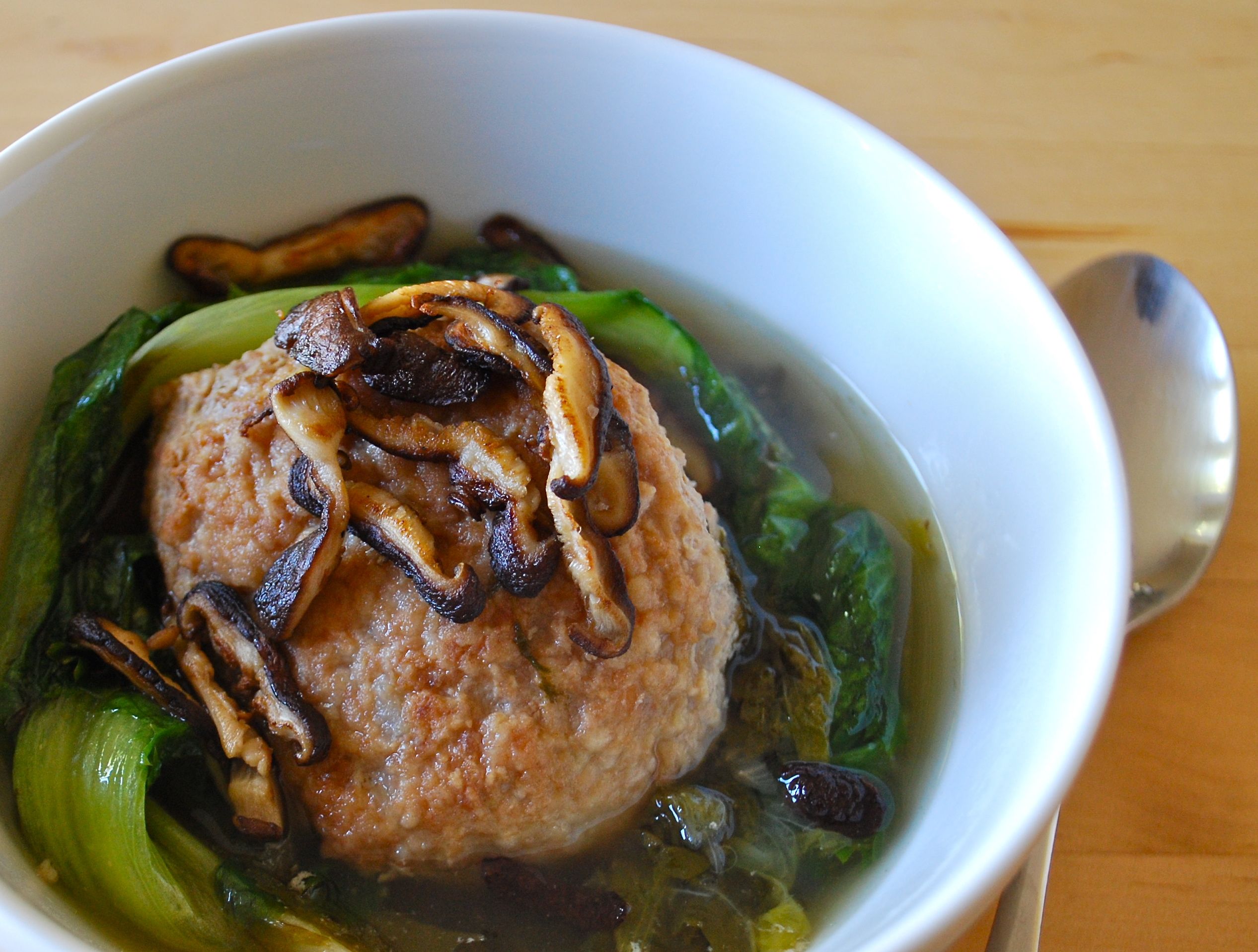 Stewed pork meatballs and escarole with crisped shiitakes