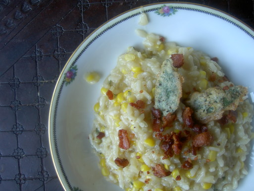 Corn Risotto garnished with Bacon & Anchovy Sage Leaf Bite