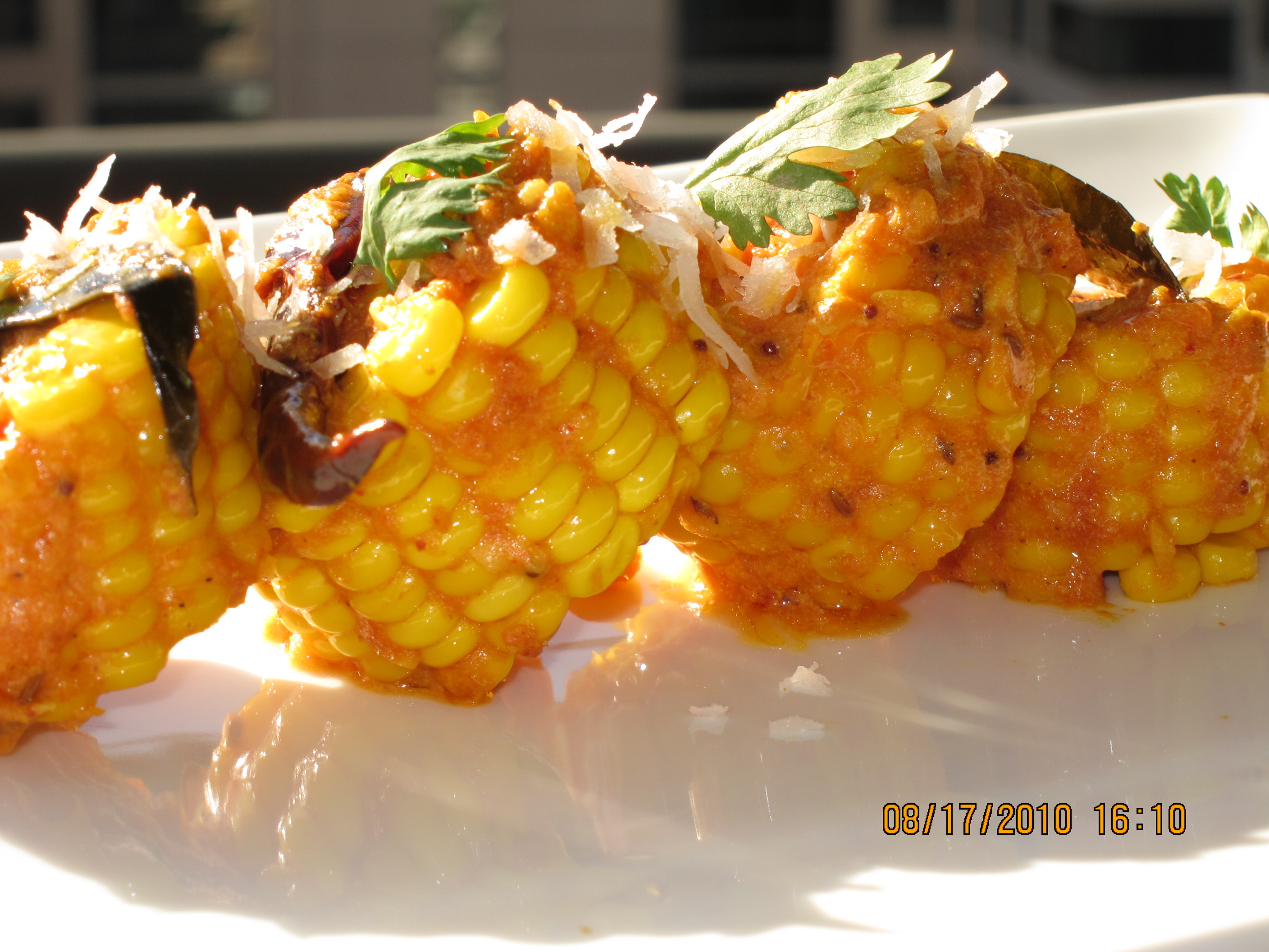 Corn in a spicy sauce of yoghurt, curry leaves, grated coconut and toasted red chillies