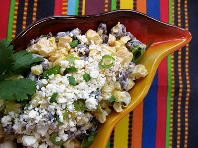 Roasted corn (esquites) with black beans, lime dressing and queso Cotija