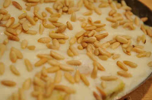 Airy Rosemary Citrus Pignole Bread Pudding