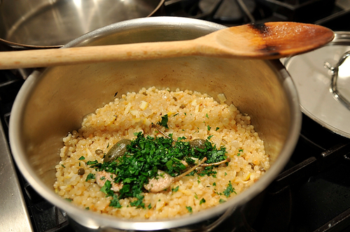Israeli Couscous with Roasted Lemons & Capers topped with Seared Scallops & a Lemon Creme Fraiche Drizzle