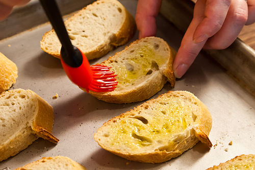 Ramped Up Crostini with Ricotta and Pea Shoots