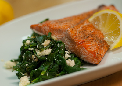 Pan Seared Salmon atop spinach salad